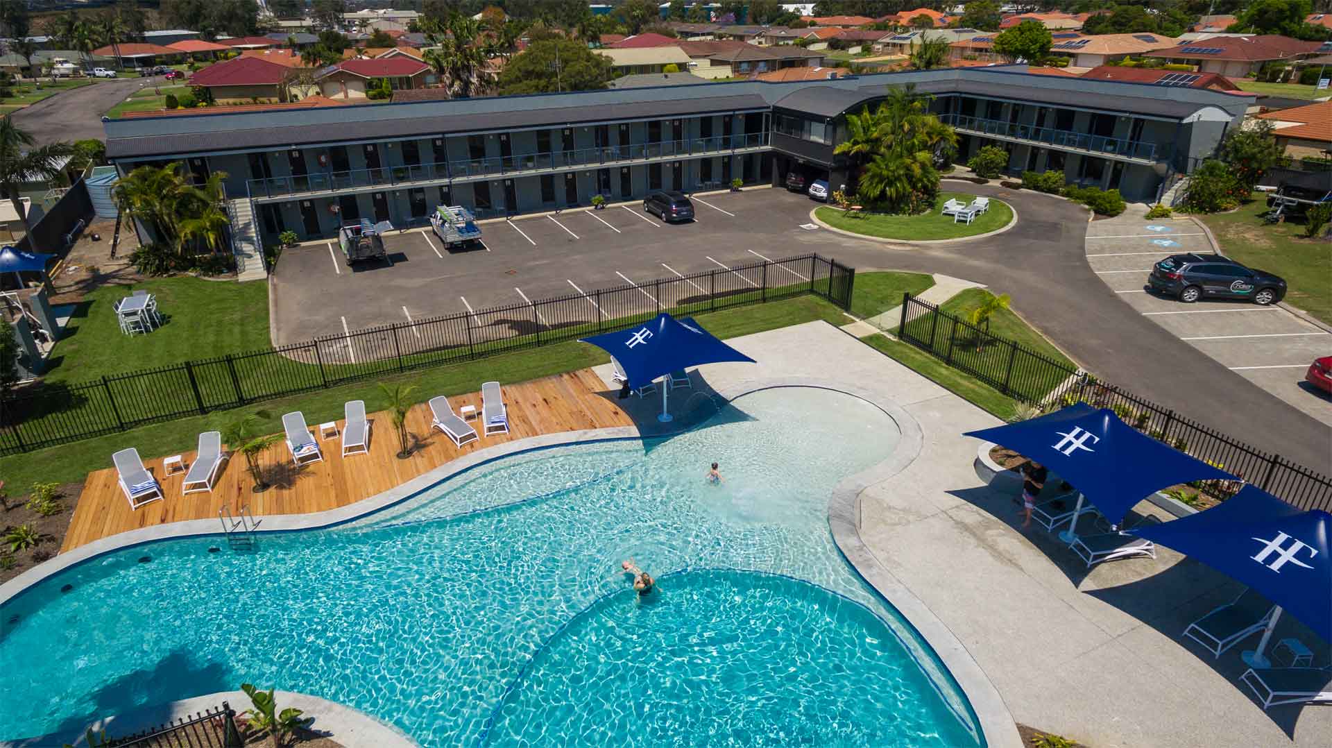 29. Aerial image of Hotel Forster including pool, water slide and tennis court